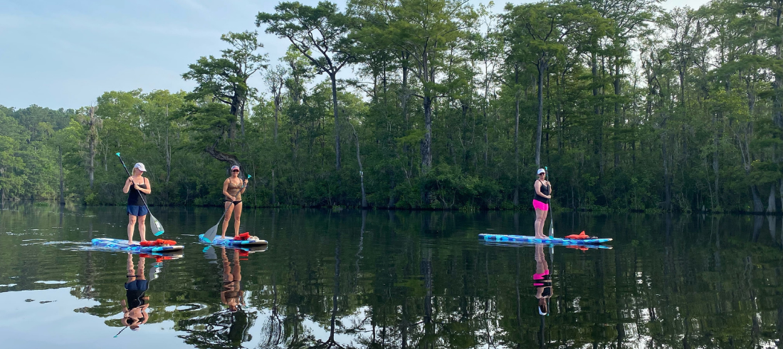 three woman stand up paddleboarding in south carolina