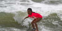 young girl taking part in a Myrtle Beach surf lesson