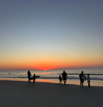 surfing at myrtle beach sunset