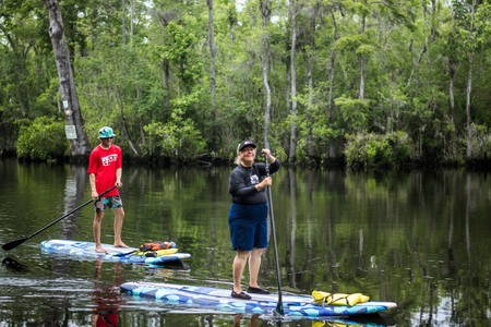 Small group paddleboarding together in Myrtle Beach